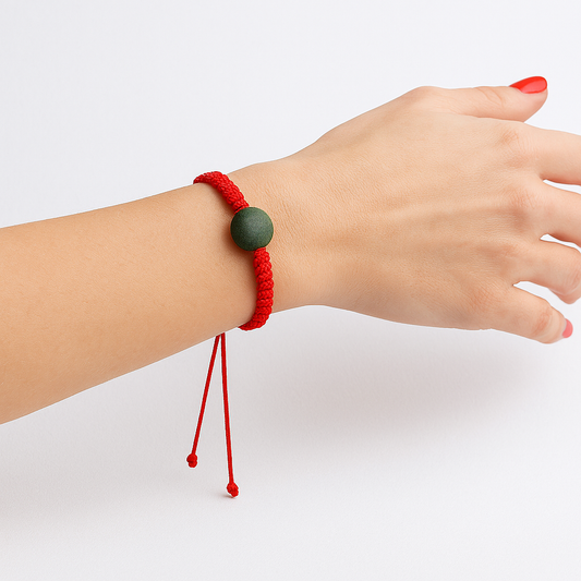 QiFlow™ Herbal Bead Bracelet – Red Cord with Green Center Bead